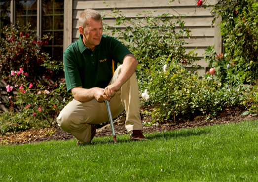 Weed Man Technician Performing Soil Test
